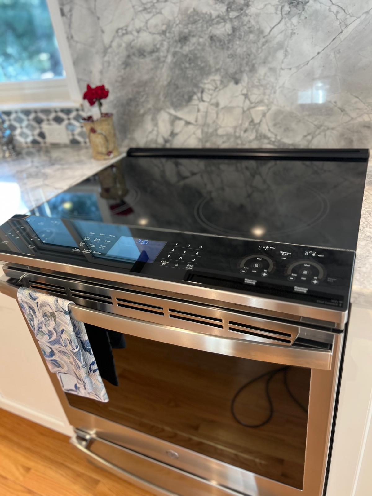 Bright, tidy kitchen with clean island, floors and appliances